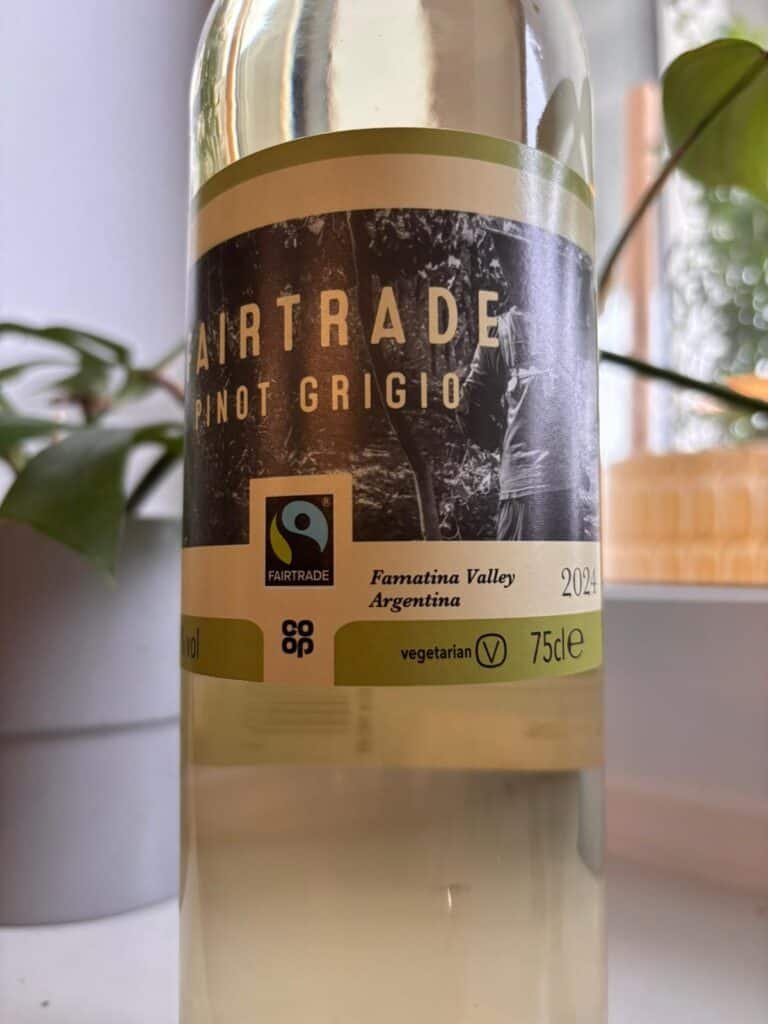 label of bottle ofwhite wine holding the Fair trade certification logo